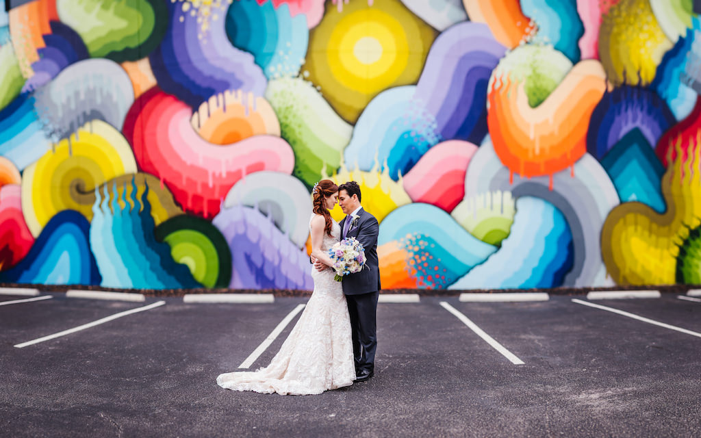 White and Dusty Purple Wedding Downtown St Pete Bride and Groom Wedding Portrait with Graffiti Mural Street Art