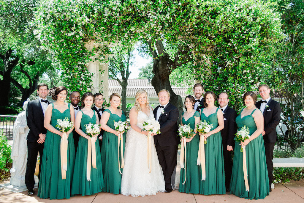 White, Gold and Green Old Florida Inspired Wedding Party Outdoor Garden Portrait, Bridesmaids in Watters Dresses, Bride in V Neck Morilee by Madeline Gardner Wedding Dress, with White Floral Bouquets with Greenery and Long Gold Ribbons | Tampa Bay Wedding Photographer Ailyn La Torre Photography