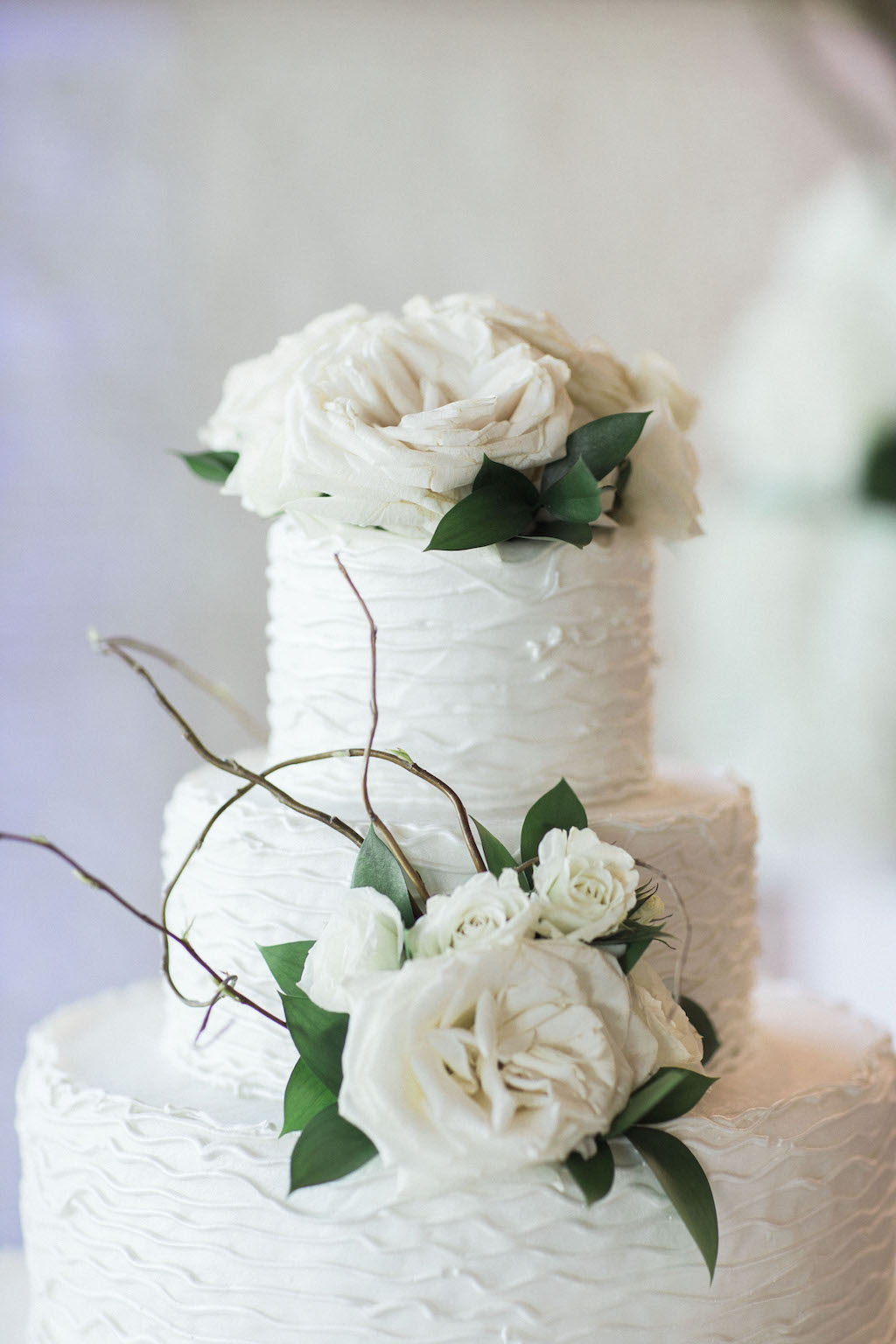 Three Tier Round White Wedding Cake with Ivory Rose and Greenery with Natural Branches