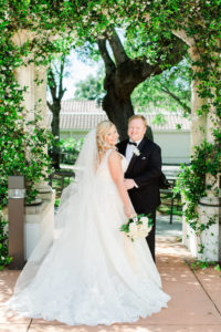 Outdoor Garden Wedding Portrait, Bride with White Garden Rose and Greenery Bouquet, Groom in Tuxedo with White Rose Boutonnière | Clearwater Wedding Photographer Ailyn La Torre Photography