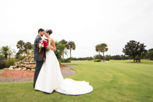 Outdoor Garden Wedding Portrait, Bride in Long Train Wedding Dress and Birdcage Veil, with White, Magenta, and Fern Bouquet | Clearwater, Florida Golf Course Wedding Venue Countryside Country Club | Wedding Dress Shop Truly Forever Bridal | Planner Special Moments Event Planning