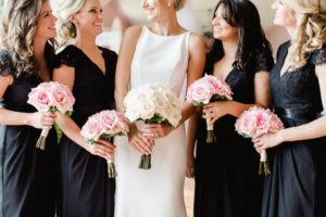 Bridal Party Portrait, Bridesmaids in Black V Neck Lace Belted David's Bridal Dresses with Pink Rose Bouquets with Greenery and Ribbon, Bride in Sleeveless Modern A Line Wedding Dress with Ivory Rose Bouquet | Tampa Bay Wedding Hair and Makeup Michele Renee The Studio | St Pete Wedding Photographer Ailyn La Torre Photography