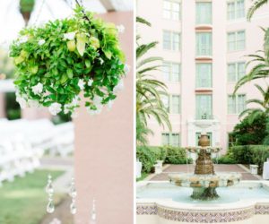 Outdoor Hotel Garden Courtyard Wedding Ceremony with Art Deco Fountain, Hanging White Floral with Greenery and White Folding Chairs | Tampa Bay Historic Hotel Wedding Venue The Vinoy Renaissance