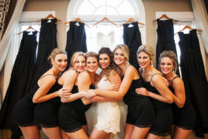 Bridal Party Getting Ready Portrait in Matching Black and White Rompers | Bella Bridesmaid Monique Lhuillier Dresses