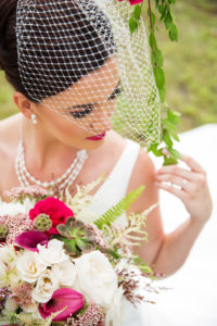 Outdoor Bridal Portrait in Birdcage Veil with Triple Strand Pearl Necklace with White Rose, Magenta and Fuschia Flower, Succulent and Fern Greenery Bouquet | Tampa Bay Wedding Hair and Makeup Michele Renee The Studio | Wedding Florist Gabro Event Services | Bridal Shop Truly Forever Bridal