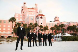 Groom and Groomsmen Wedding Party Outdoor Beach Portrait in Black Tuxedoes | St Pete Beach Historic Hotel Wedding Venue The Don Cesar