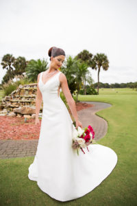 Outdoor Garden Bridal Portrait in A Line Wedding Dress and Birdcage Veil with Pearl Necklace, and White, Fuchsia, and Fern Bouquet | Clearwater Golf Course Wedding Venue Countryside Country Club | Bridal Shop Truly Forever Bridal | Florist Gabro Event Services