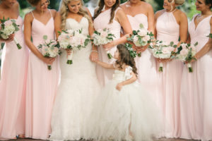 Outdoor Garden Bridal Party Portrait, Bridesmaids in Mismatched Azazi Blush Pink Floor Length Dresses, Bride in Strapless A Line Wedding Dress with White, Blush, and Greenery Bouquets with Flower GIrl | Downtown St Petersburg Wedding Venue The Birchwood