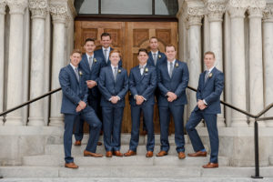 Downtown Tampa Outdoor Groomsmen Wedding Portrait in Blue Suits with Gray Ties, Brown Shoes, and Cream Rose Boutonniere | Tampa Wedding Photographer Marc Edwards Photographs