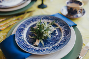 Mediterranean Sage Green and Cobalt Blue Wedding Reception Table Place Setting with Succulent Greenery Bundle, Blue Painted China, Green Charger and Blue Napkin with Blue Painted China Teacup | Sarasota Wedding Planner Jennifer Matteo Event Planning