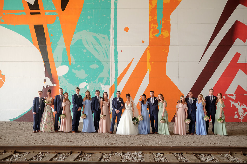 Downtown Tampa Industrial Wedding Party Portrait by Train Tracks, Bridesmaids in Blue, Green, and Pink | Wedding Photographer Marc Edwards Photographs