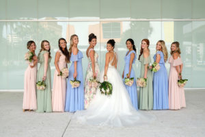 Outdoor Bridal Party Portrait, Bride in Cross Back Ballgown Madeline Gardner Wedding Dress with White Floral Bouquet with Greenery, Bridesmaids in Mismatched Morilee Bridal Dresses in Pink, Blue, and Sage Green, and Pink and Green Floral White Maid of Honor Dress | Tampa Wedding Photographer Marc Edwards Photographs