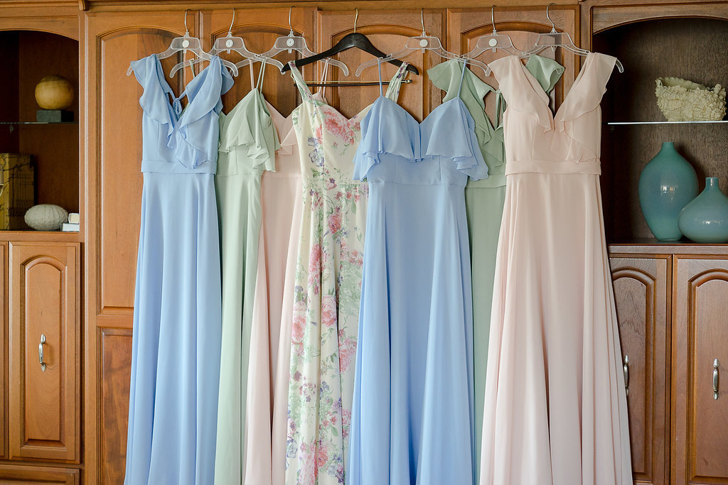 Morilee Bridal Mismatched Empire Waist Bridesmaids Dresses in Sage Green, Light Blue, Blush Pink, and White and Pink Floral Maid of Honor Dress