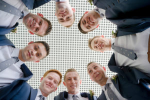 Creative Outdoor Groomsmen Wedding Portrait, In Navy Blue Suits with Grey Ties | Tampa Bay Wedding Photographer Marc Edwards Photographs