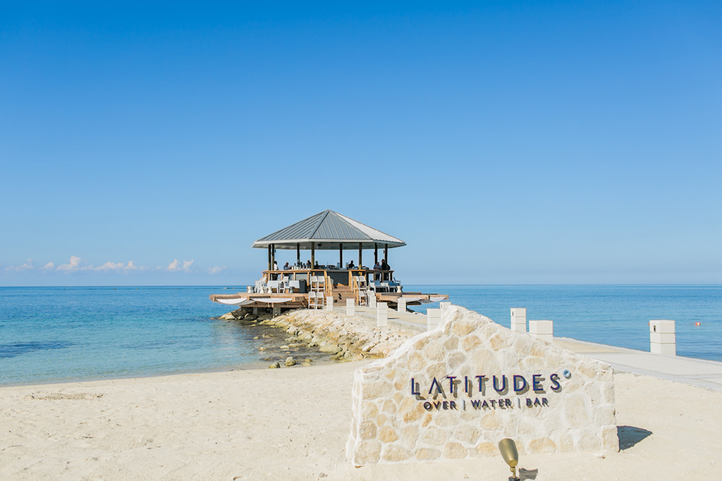 Sandals South Coast Jamaica Destination Caribbean Wedding and Honeymoon Overwater Latitudes Beach Bar | Alexis June Weddings