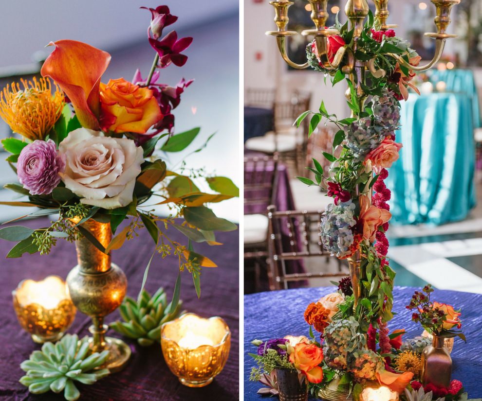 Whimsical Jewel Tone Wedding Reception Centerpieces, Tall Candelabra with Hanging Peach, Pink, and Orange Flower Garland with Succulents and Greenery, Small Gold Mercury Votives, and Small Pink, Orange and Purple Rose and Calla Lily In Antique Gold Vase Centerpiece with Greenery on Amethyst Purple, Emerald Green, and Midnight Blue Satin Linens