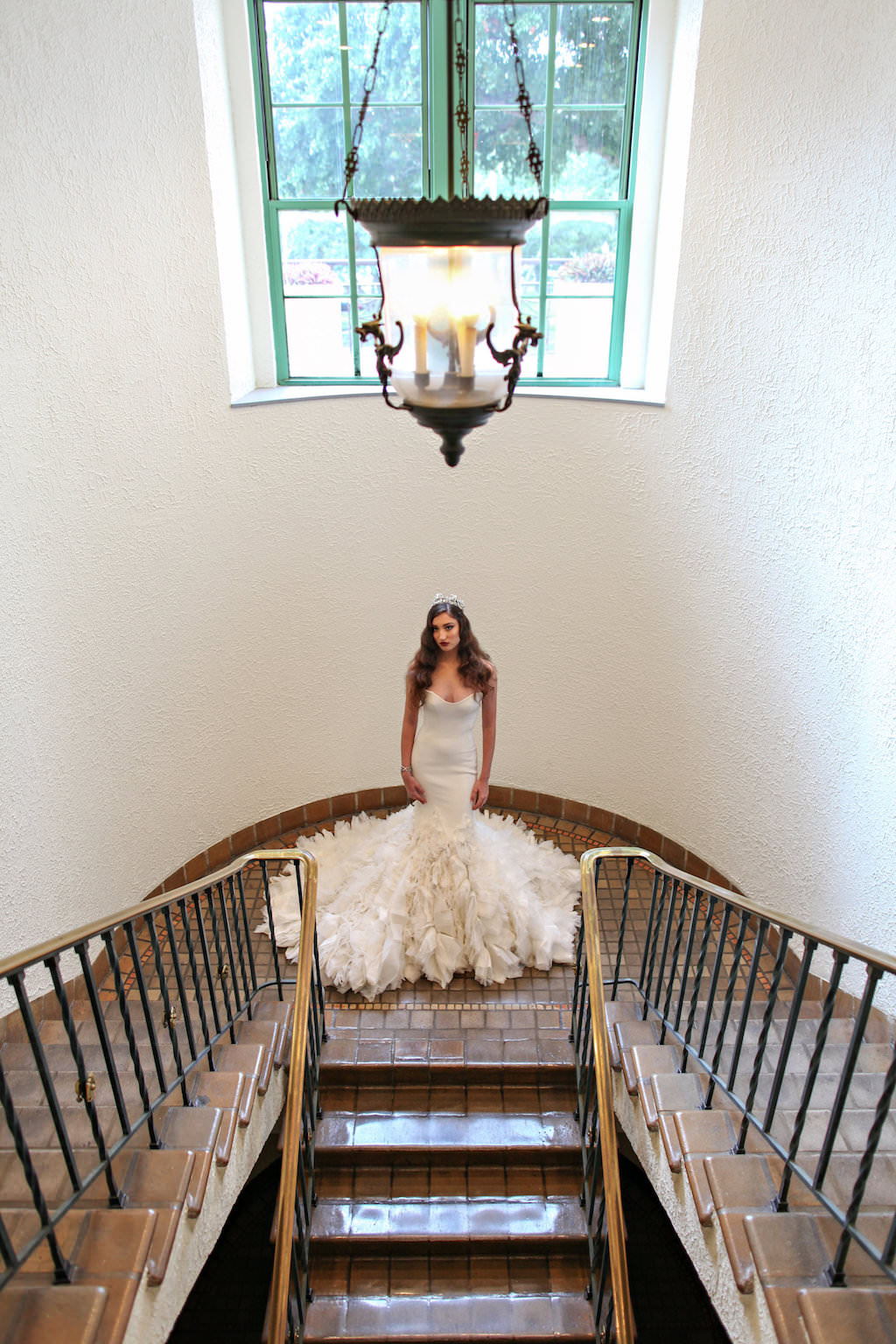 Bridal Indoor Staircase Portrait in Layered Mermaid Ines Di Santo Strapless Wedding Dress | St Petersburg FL Historic Venue Vinoy Renaissance