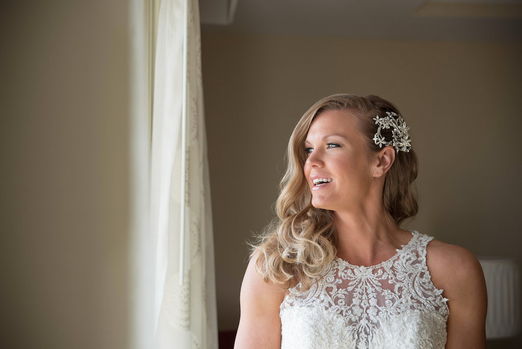 Interior Bride Getting Ready Portrait wearing Essence of Australia Embroidered Illusion Neckline Wedding Dress with Silver Floral Hair Accessory | Tampa Bay Wedding Photographer Kristen Marie Photography
