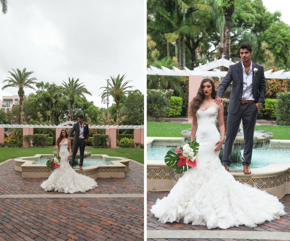 Outdoor Hotel Garden Wedding Portrait, Bride in Layered Mermaid Ines Di Santo Strapless Wedding Dress with Pink and White Lily with Green Fern Tropical Bouquet, Groom in Gray Suite with Boutonniere | St Petersburg FL Historic Venue Vinoy Renaissance