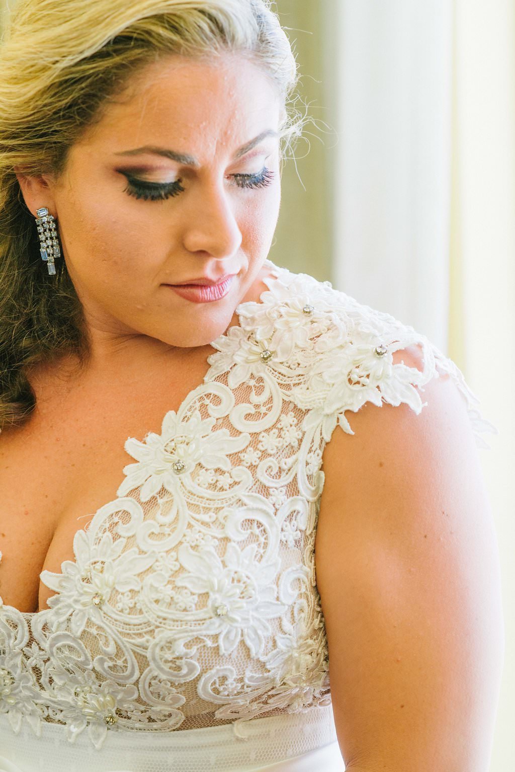 Interior Bride Getting Ready Portrait in Sheer Floral Lace V Neck Wedding Dress