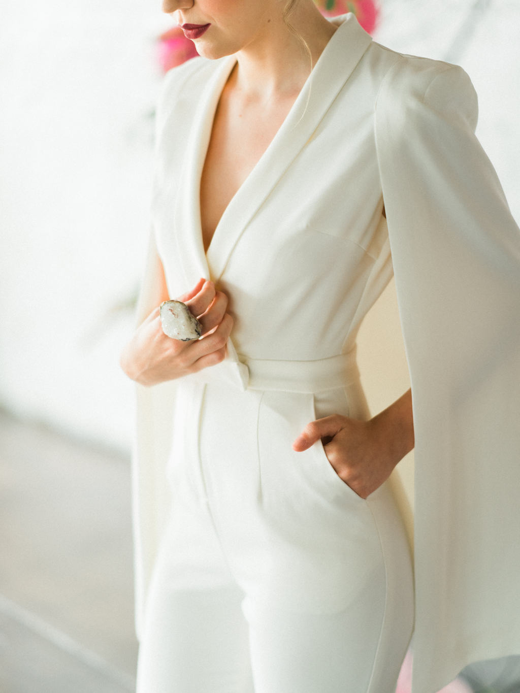 Modern Bride with Oversized Adina Mills Geode Ring wearing Lavish Alice White Jumpsuit with Cape