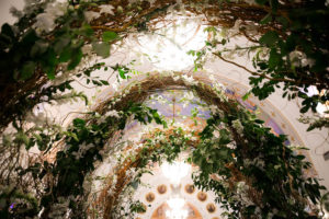Traditional Greek Wedding Ceremony Interior Decor with Enchanted Garden Wild Branch Arch with White Florals and Greenery | Tarpon Springs Traditional Wedding Venue St. Nicholas Greek Orthodox