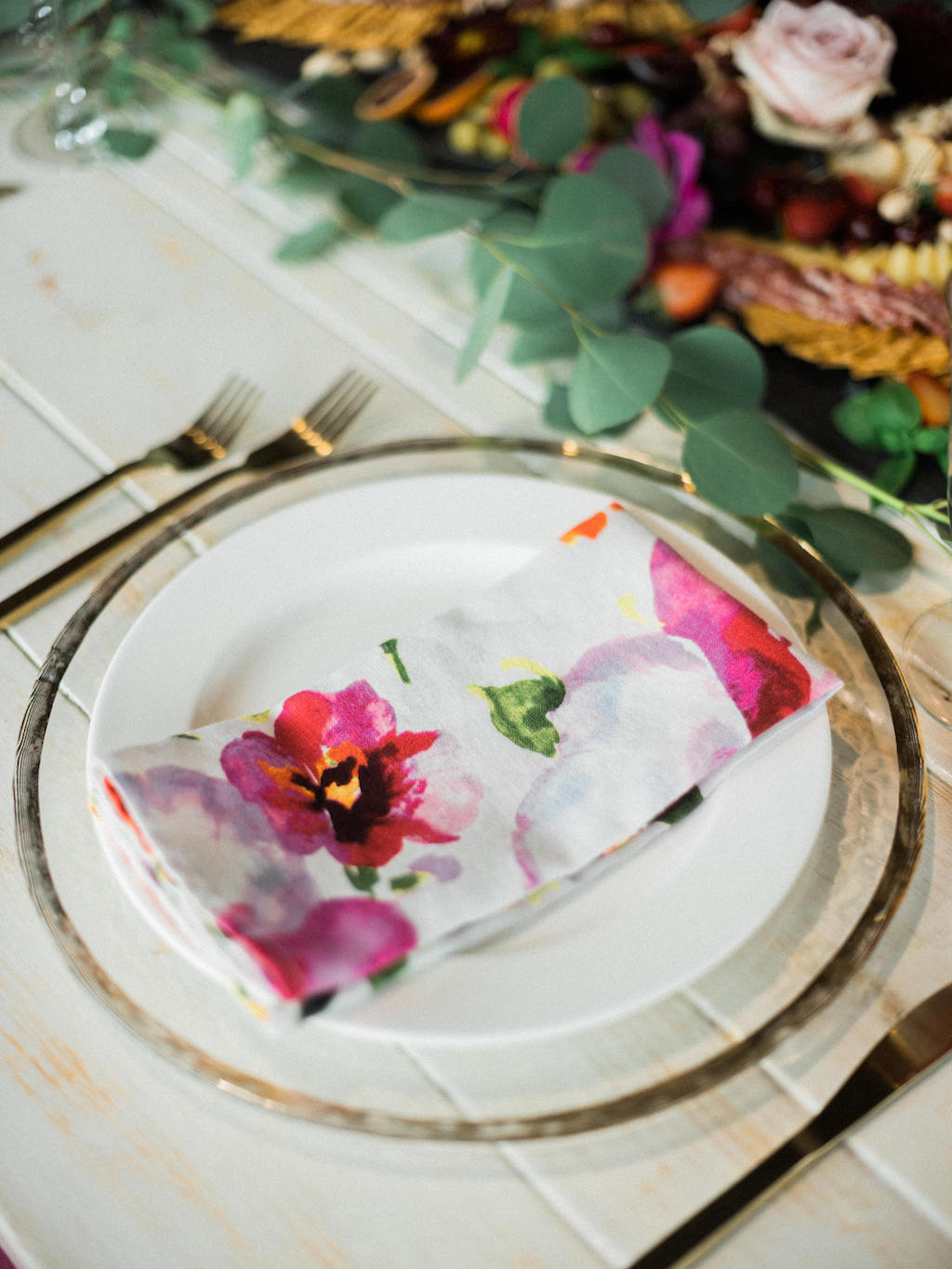 Modern Fuchsia Wedding Reception Table Setting with Watercolor Printed Napkin, Gold Flatware, Glass Charger | Dish and Charger Rentals by A Chair Affair