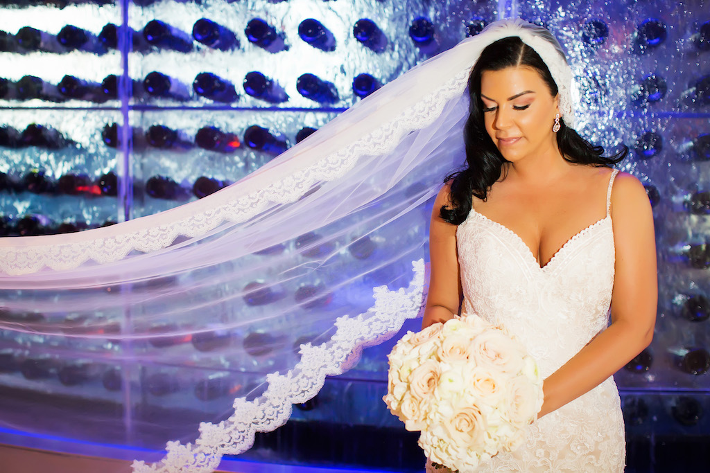 Bridal Portrait with White Bouquet in Long Lace Trimmed Veil in Wine Cellar at Waterfront Hotel Wedding Venue The Westin Tampa Bay