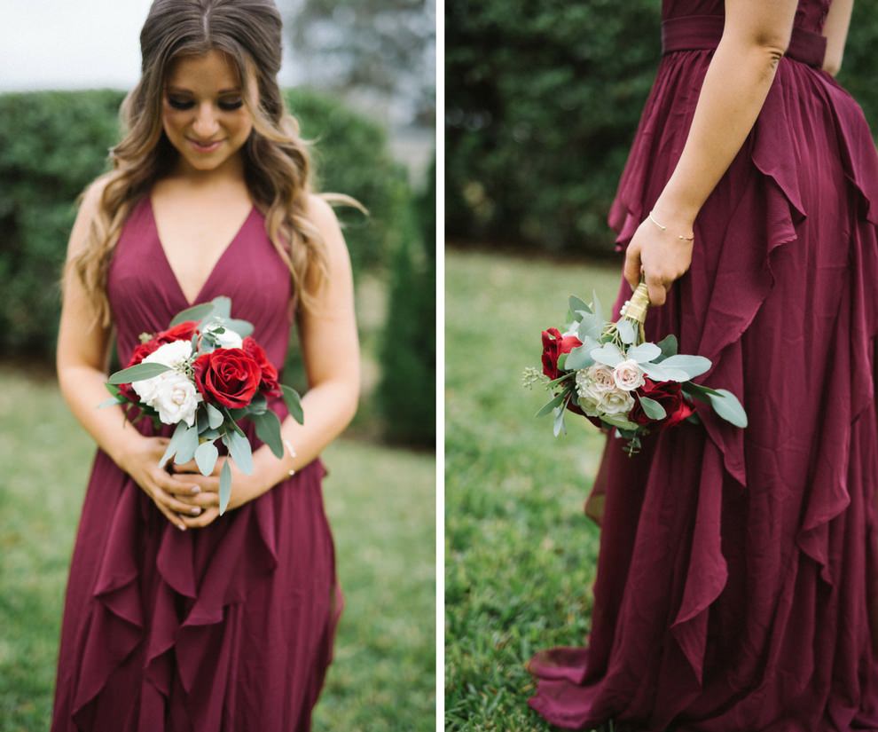 Outdoor Garden Bridesmaid Portrait wearing V Neck Layered Skirt Burgundy David's Bridal Dress, with Red and White Rose with Greenery Bouquet | Tampa Bay Wedding Photographer Kera Photography