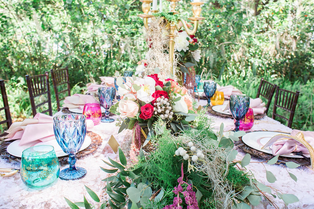 Outdoor Whimsical Boho Garden Wedding Reception Decor with Vintage Mismatched Dishes and Garland Floral Table Runner