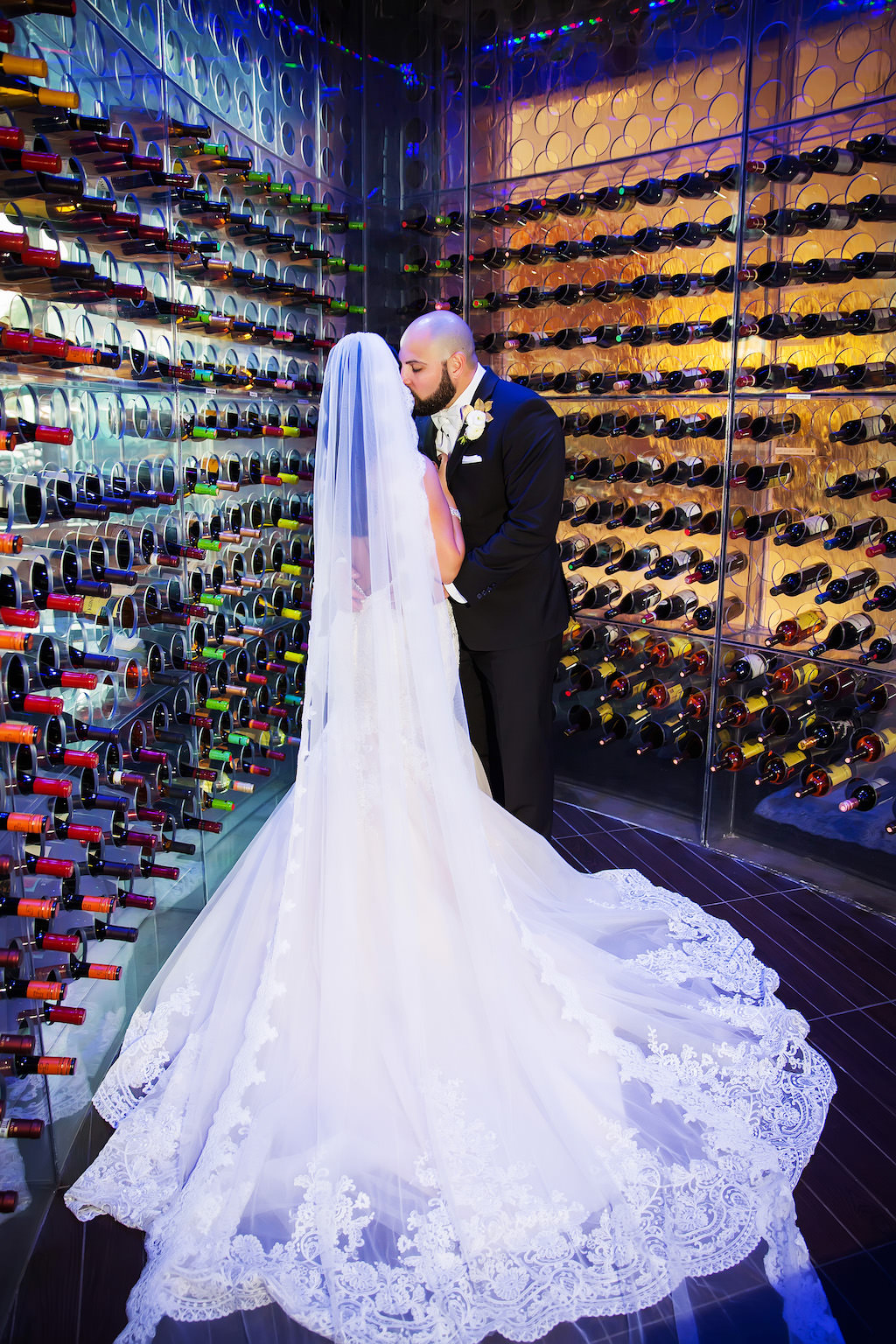 Bride and Groom Wedding Portrait in Wine Cellar, Bride in Cathedral Length Lace Trimmed Veil | Luxury Hotel Wedding Venue The Westin Tampa Bay