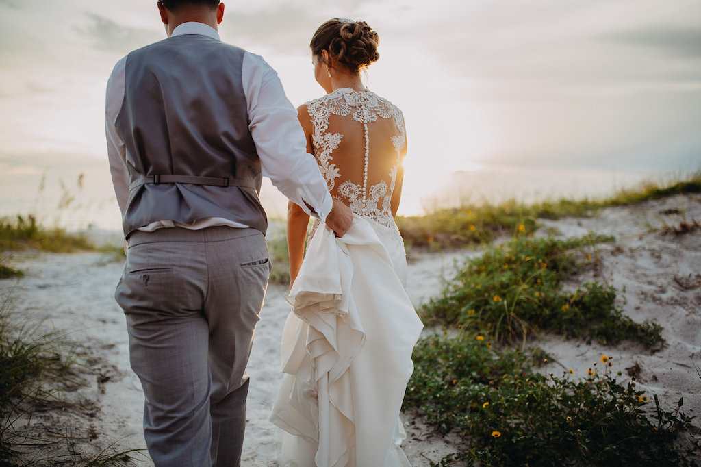 Outdoor Beach Sunset Bride and Groom Wedding Portrait, Bride in Lace Illusion Back Sincerity Bridal Wedding Dress, Groom in Gray Vest | Tampa Bay Wedding Photographer Rad Red Creative