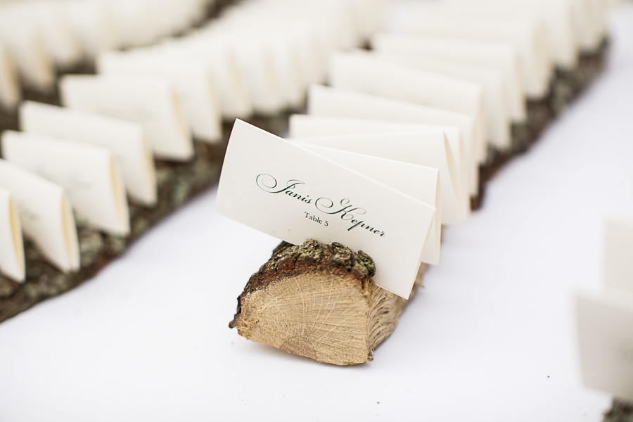 Hunter Green Script Printed on White Escort Cards in Natural Edged Wood with Bark Holders