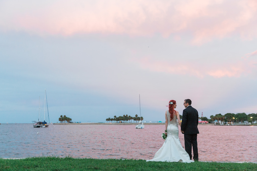 Outdoor Waterfront Downtown St. Pete Sunset Wedding Portrait, Bride with Floral Hair Accessory and Trumpet Allure Bridal Dress