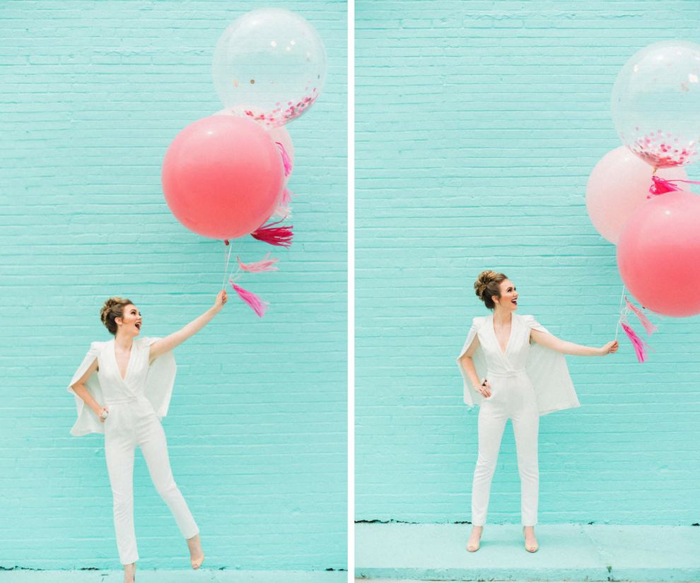 Modern Outdoor Bridal Portrait in White Lavish Alice Jumpsuit with Cape with Oversized Giant Balloons Filled with Pink Glitter | Modern Tampa Bay Wedding Venue Haus 820