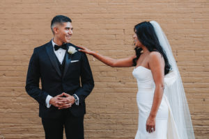 Modern Indian Wedding First Look Bride and Groom Portrait, Bride In Strapless Wedding Dress Groom in Black Tux With White Rose Boutonniere | Tampa Wedding Photographer Grind and Press Photography