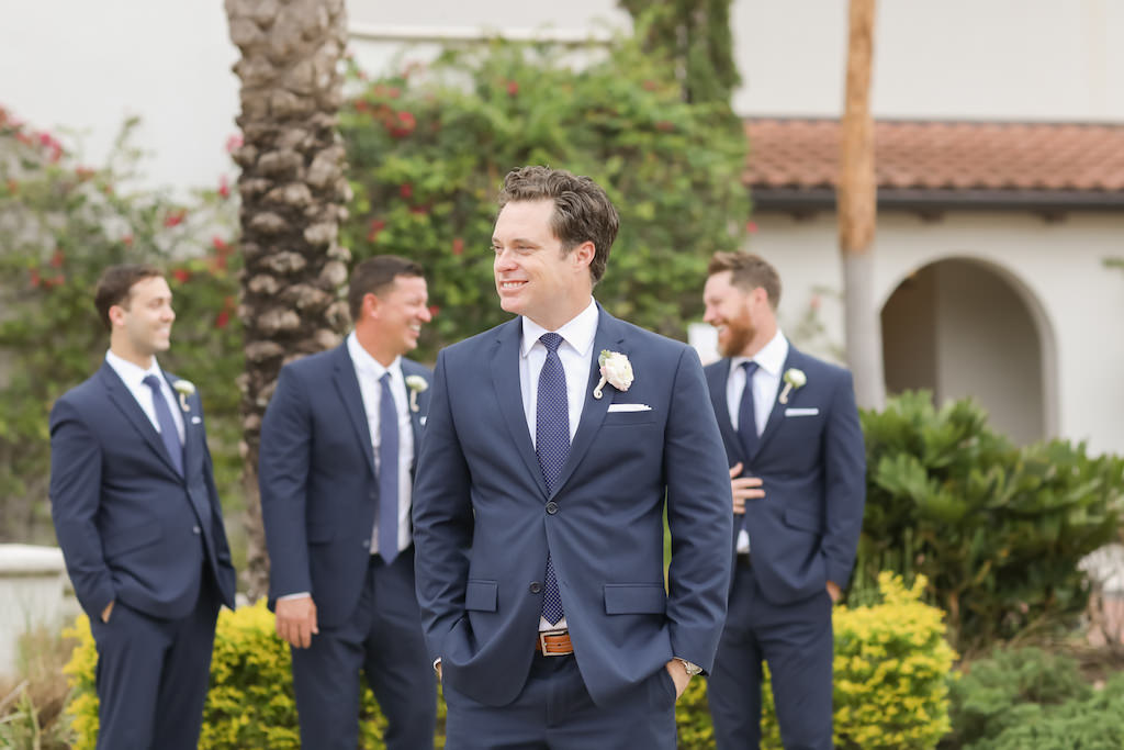 Outdoor Groomsmen Portrait, Wearing Navy Blue Suits with Blue TIes, White Shirts, and White Floral Boutonniere | Tampa Bay Wedding Venue The Westshore Yacht Club | Photographer Lifelong Studios Photography
