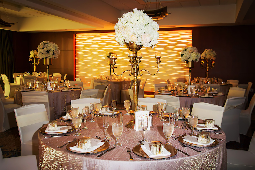 Luxurious Gold and White Wedding Reception with Round Tables with Blush and Gold Textured Table Cloths, Tall Gold Candelabra with White Floral Centerpieces | Hotel Wedding Reception Venue The Westin Tampa Bay