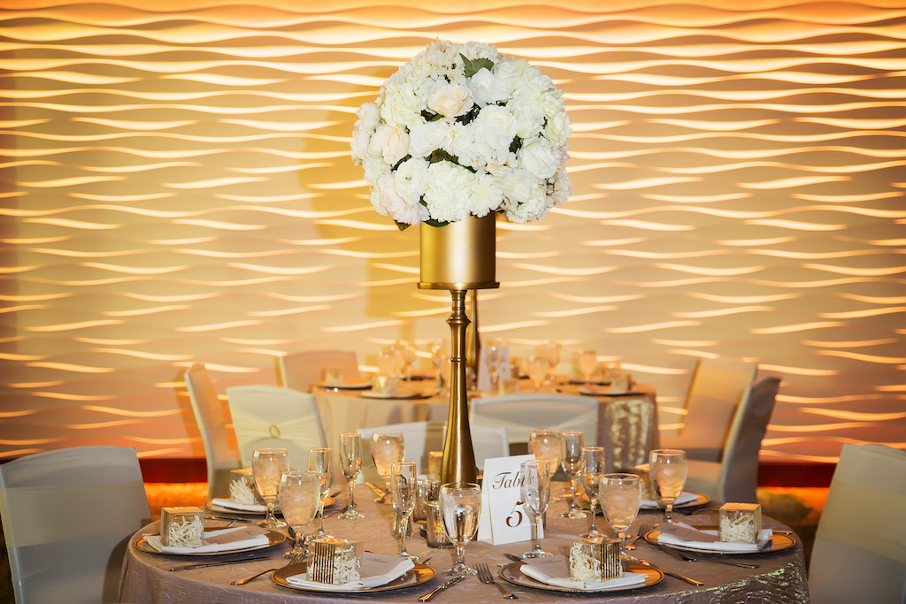Luxurious Gold and White Wedding Reception with Round Tables with Blush and Gold Textured Table Cloths, Tall Gold Vase with White Floral Centerpieces | Hotel Wedding Reception Venue The Westin Tampa Bay