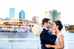 Outdoor Waterfront Downtown Tampa Wedding Portrait, Bride with White Rose Bouquet, Groom in Navy Blue Suit | Tampa Bay Nautical Wedding Venue The Yacht StarShip