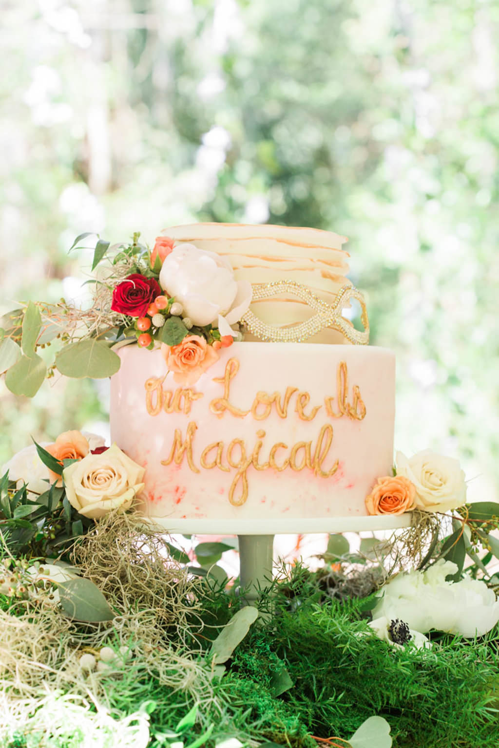 Whimsical Rustic Two Tier Round Blush Pink Wedding Cake with "Love Is Magical" Written