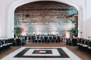 Modern Black and White Indian Wedding Reception with Black Linens, Clear Plastic Oval Back and Black Chiavari Chairs, and Tall Greenery Centerpieces and Black and White Geometric Dancefloor | Tampa Bay Historic Wedding Venue The Rialto Theater | Planner Glitz Events