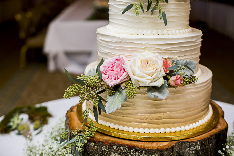 Elegant Pink and Green Nature Inspired Hotel Ballroom Wedding Reception with Round White to Gold Ombre Wedding Cake with Pink, White, Orange Roses and Greenery, on Natural Edged Wood Round Cake Stand, with Succulents and Baby's Breath | St Pete Wedding Bakery The Artistic Whisk