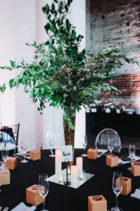 Modern Black and White Indian Wedding Reception with Black Linens, and Tall Greenery Centerpieces in Clear Vases with Pillar Candles | Tampa Bay Historic Wedding Venue The Rialto Theater | Planner Glitz Events
