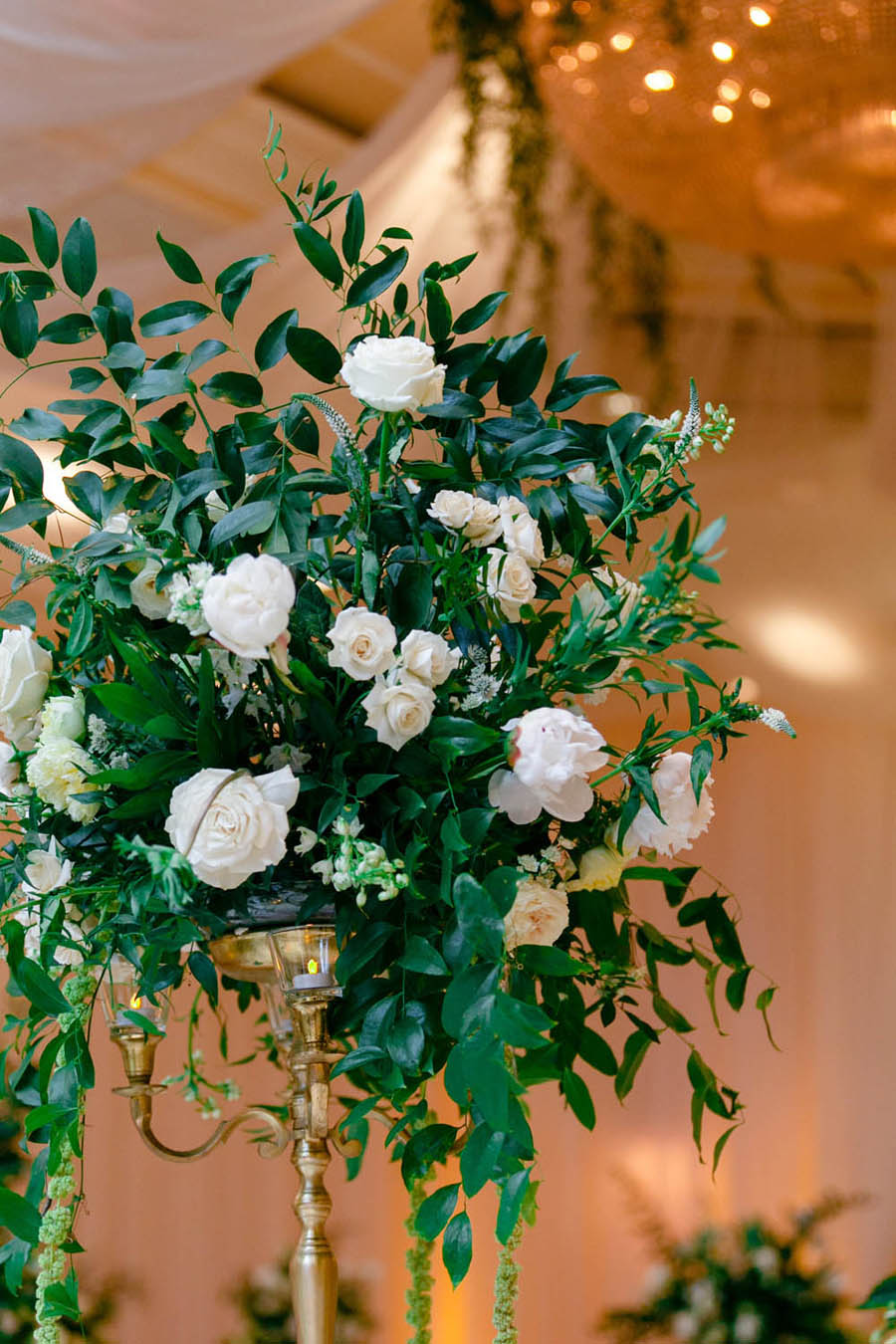 White Floral and Wild Natural Greenery Centerpiece in Gold Candelabra