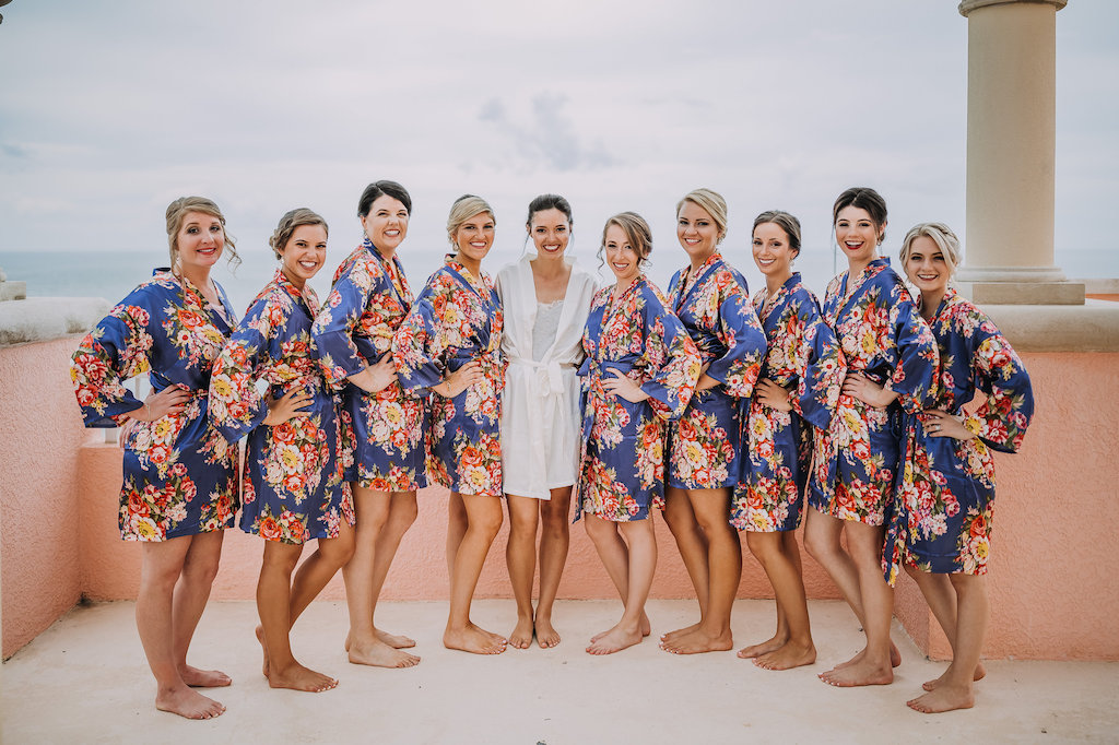 Outdoor Rooftop Bridal Party Getting Ready Portrait in Matching Blue and Red Floral Silk Robes | Tampa Bay Wedding Photographer Red Rad Creative