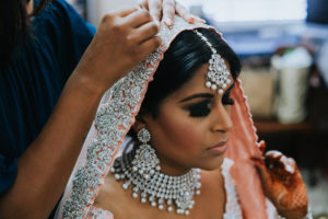 Traditional Hindu Indian Wedding Bride Getting Ready Portrait in peach and Silver Saree | Tampa Wedding Photographer Grind and Press Photography