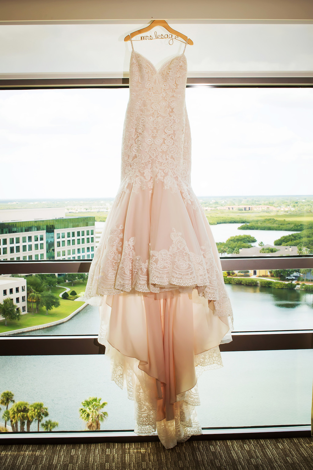 Blush Lace Mermaid Wedding Dress on Custom Hanger at Westin Tampa Bay