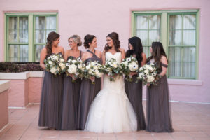 Outdoor Bridal Party Portrait, Bride in Strapless Mermaid Lazaro Dress, Bridesmaids in Mismatched Layered Mauve Jenny Yoo Dresses, with White FLoral and Anemone with Greenery Bouquet | Tampa Bay Wedding Photographer Marc Edwards Photographs | Hair and Makeup Femme Akoi Studio | St Pete Historic Hotel Venue The Vinoy