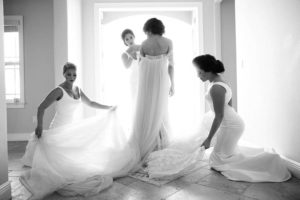Bridal Getting Ready Portrait, Bridesmaids in Floorlength White Bella Bridesmaids Hayley Paige Dresses